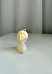Candle in form of bust of beautiful woman