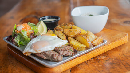 typical meat dishes with rice in country restaurant