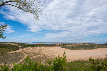 Landscape of sand dunes, Lake Michigan, and a distant shoreline