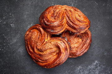 baked buns with sugar, on gray concrete