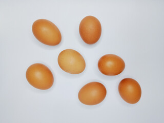 Seven chicken eggs isolated on white background