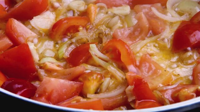 Red spicy sauce with vegetables tomatoes onions carrots