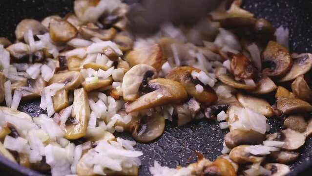 Mushrooms are fried in oil and cut into thin slices to prepare the sauce