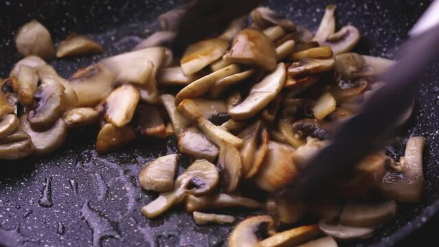Mushrooms are fried in oil and cut into thin slices to prepare the sauce