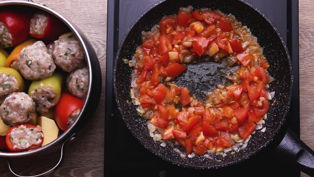 Red spicy sauce with vegetables tomatoes onions carrots