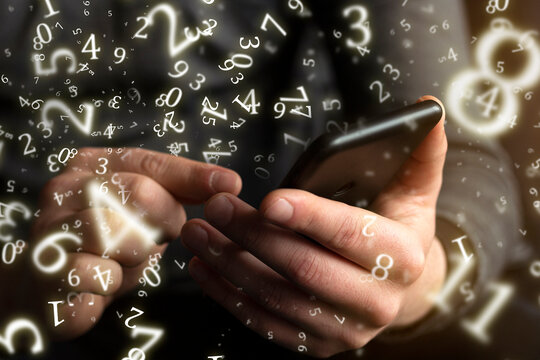 numerology, investment, young businessman using smartphone business, technology and social media concept surrounded by numbers - Powered by Adobe
