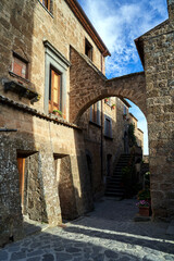 Fototapeta na wymiar Cobbled street with stone buildings in Bagnoregio