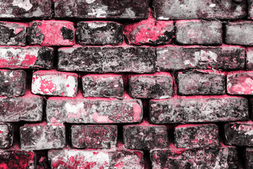 Pink brick wall of old faded bricks as a background. Grunge texture. Loft style.	