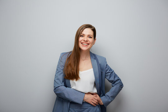 Smiling business woman portrait on gray background.