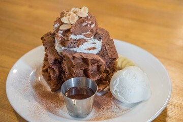 Chocolate waffle with ice cream served on plate