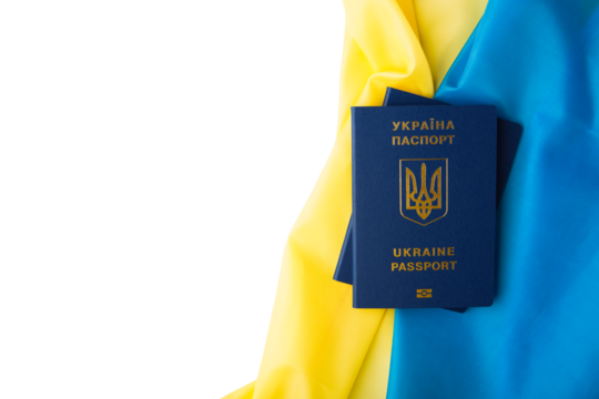 international passport of ukraine against the background of the national flag. war on ukraine