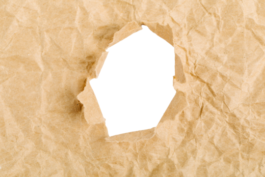 yellow Hole in the paper with torn sides.