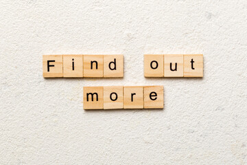 Find out more word written on wood block. Find out more text on cement table for your desing, Top view concept
