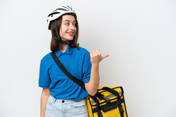 Young Ukrainian woman with thermal backpack isolated on white background pointing to the side to present a product