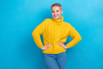 Photo of cheerful charming cute lady wear cozy trendy clothes hands on waist standing near empty...