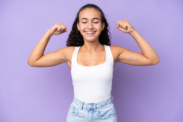 Young woman isolated on purple background doing strong gesture