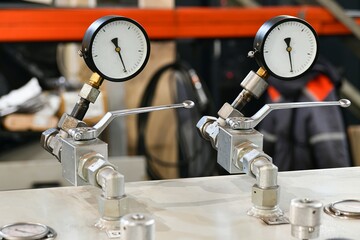 Pressure switching valve of a high-pressure hydraulic oil station with pressure gauges.