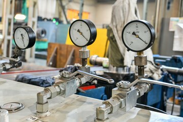 High pressure gauges with changeover valves in the hydraulic supply system.