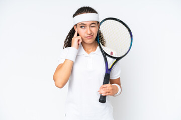 Young tennis player woman isolated on white background frustrated and covering ears