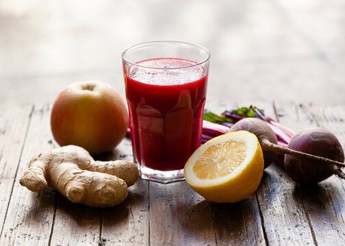 Glass of fresh beetroot ginger smoothie; concept: healthy nutrition