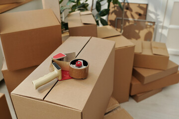 High angle view of boxes with adhesive tape for packing things for moving