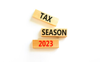 Tax season 2023 symbol. Concept words Tax season 2023 on wooden blocks on a beautiful white table...
