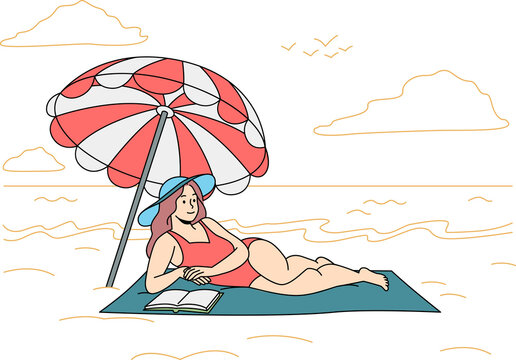 Happy woman in swimsuit lying on beach