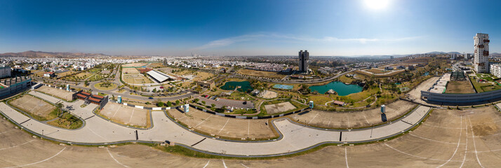 Urban panorama of the city of Angelopolis, Puebla surrounded by residential streets and green areas...