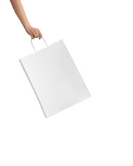 Female hand with big white paper bag without logo, mockup.