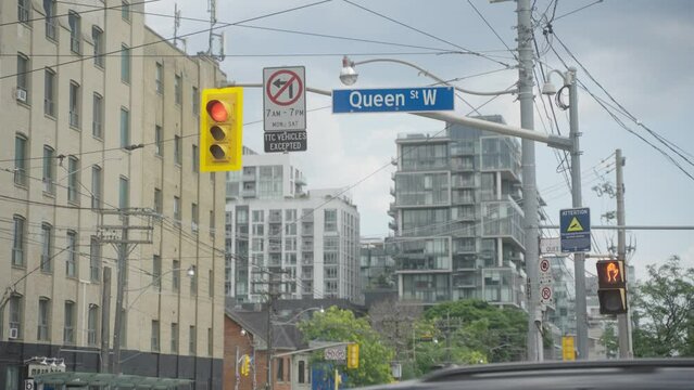 Queen Street Sign Handheld Rec709 Slow Motion