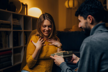 Surprised girlfriend gets a present for Valentine's day