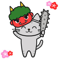 節分の鬼になりきって楽しむグレーのトラ猫