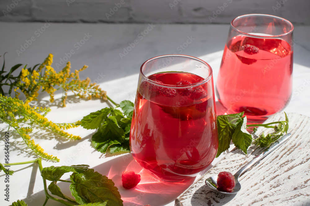 Wall mural drink with raspberries on a light background