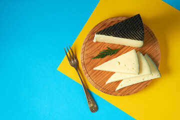 Semi-cured cheese with colorful background