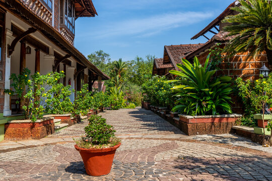 Punnamada Resort, Alappuzha, Kerala, India - 19.01.2023: Beautiful tropical hotel with plants garden. Wooden roof structure. Eco design concept. Hight quality photo