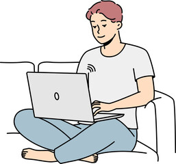 Smiling man on couch using laptop