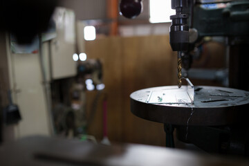 Part machining with drilling machine