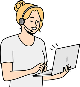 Woman in headset holds laptop, communicates with colleagues.