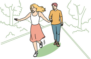 Happy couple walking in park