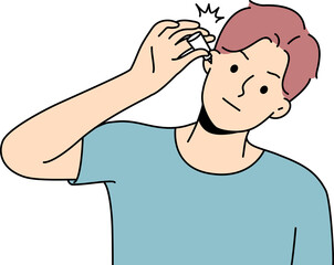 Unhealthy man using eardrops