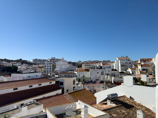 Old town in the center of Lagos, Algarve region, Portugal. Showing beach with blue skies