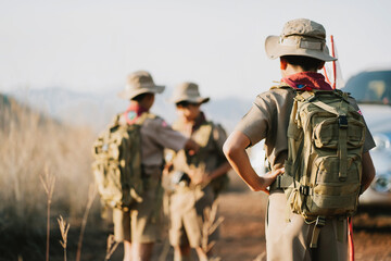 Asian boy scout escapes into the mountains and goes to camp.