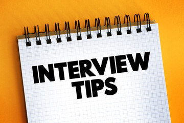 Interview Tips text on notepad, concept background