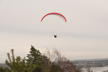 Paraglider setting off from a cliff.