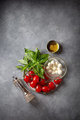Caprese salad ingredients - tomatoes, cheese and basil.