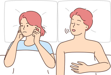Fototapeta premium Unhappy woman suffer from man snoring