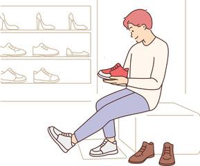Happy man try shoes in boutique