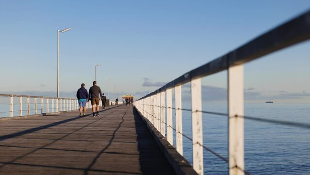 Couple Walk on Jetty in Semaphore during Morning Light