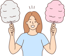 Smiling woman holding cotton candy