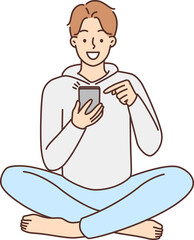 Smiling man using cellphone